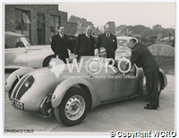 Photo of Warwick & Leamington MP Anthony Eden at The Healey Motor Company's Cape Works with Donald Healey and some of the directors
